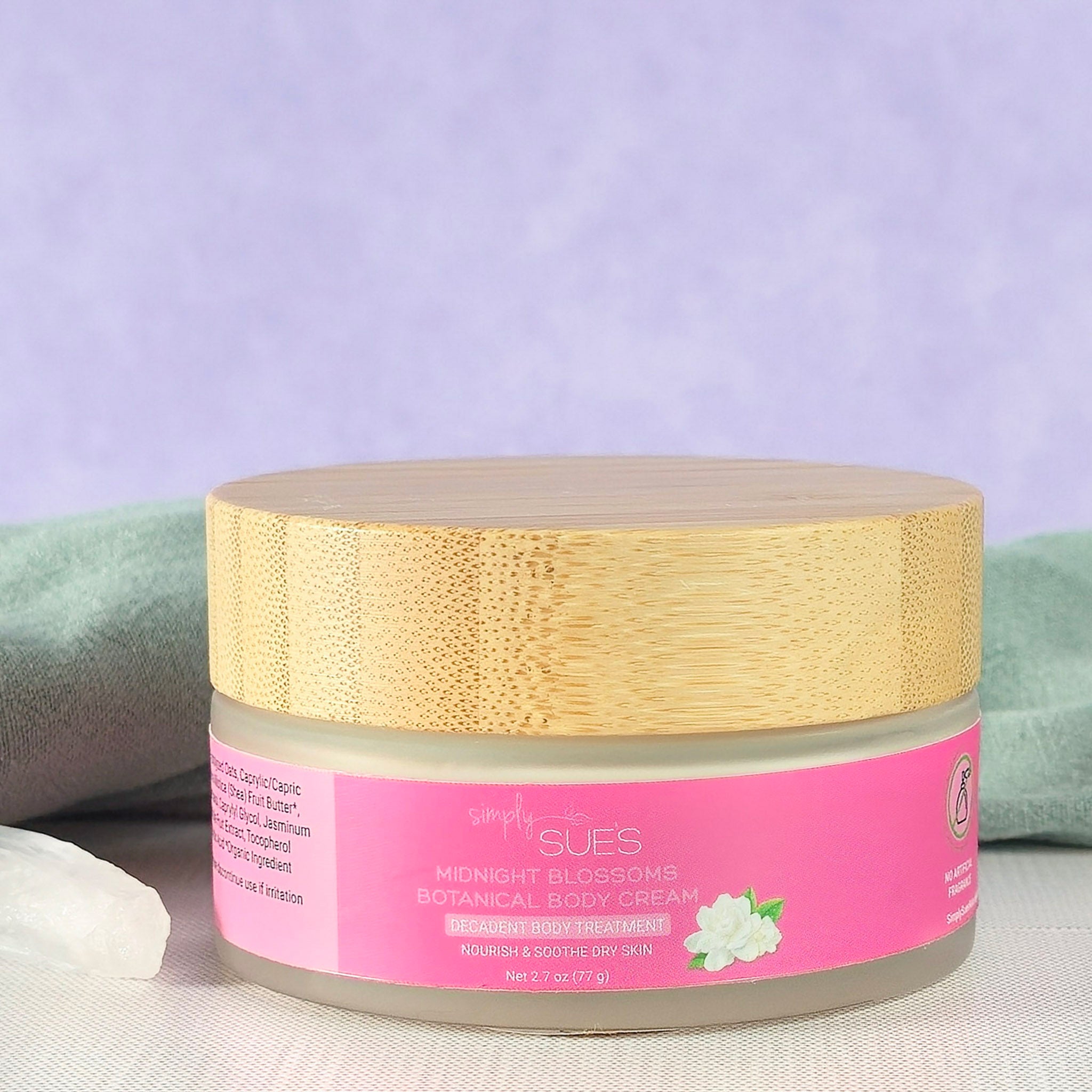 Midnight blossom body cream in glass jar with bamboo cap, natural moisturizing skincare