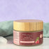 Natural facial scrub with bamboo, oatmeal, and raspberry seeds in a glass jar with bamboo lid, gently exfoliating and smoothing skin