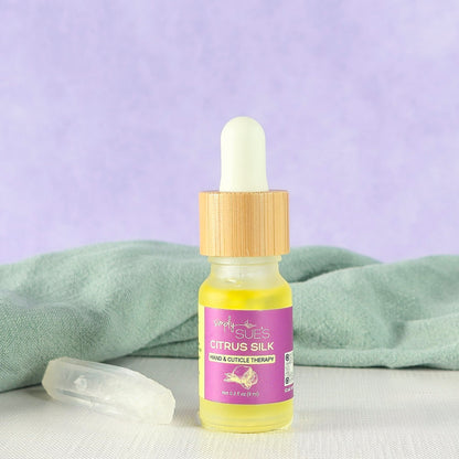 Cuticle oil in a glass bottle with bamboo cap, nourishing hand and nail care that softens and restores cuticles