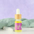 Cuticle oil in a glass bottle with bamboo cap, nourishing hand and nail care that softens and restores cuticles