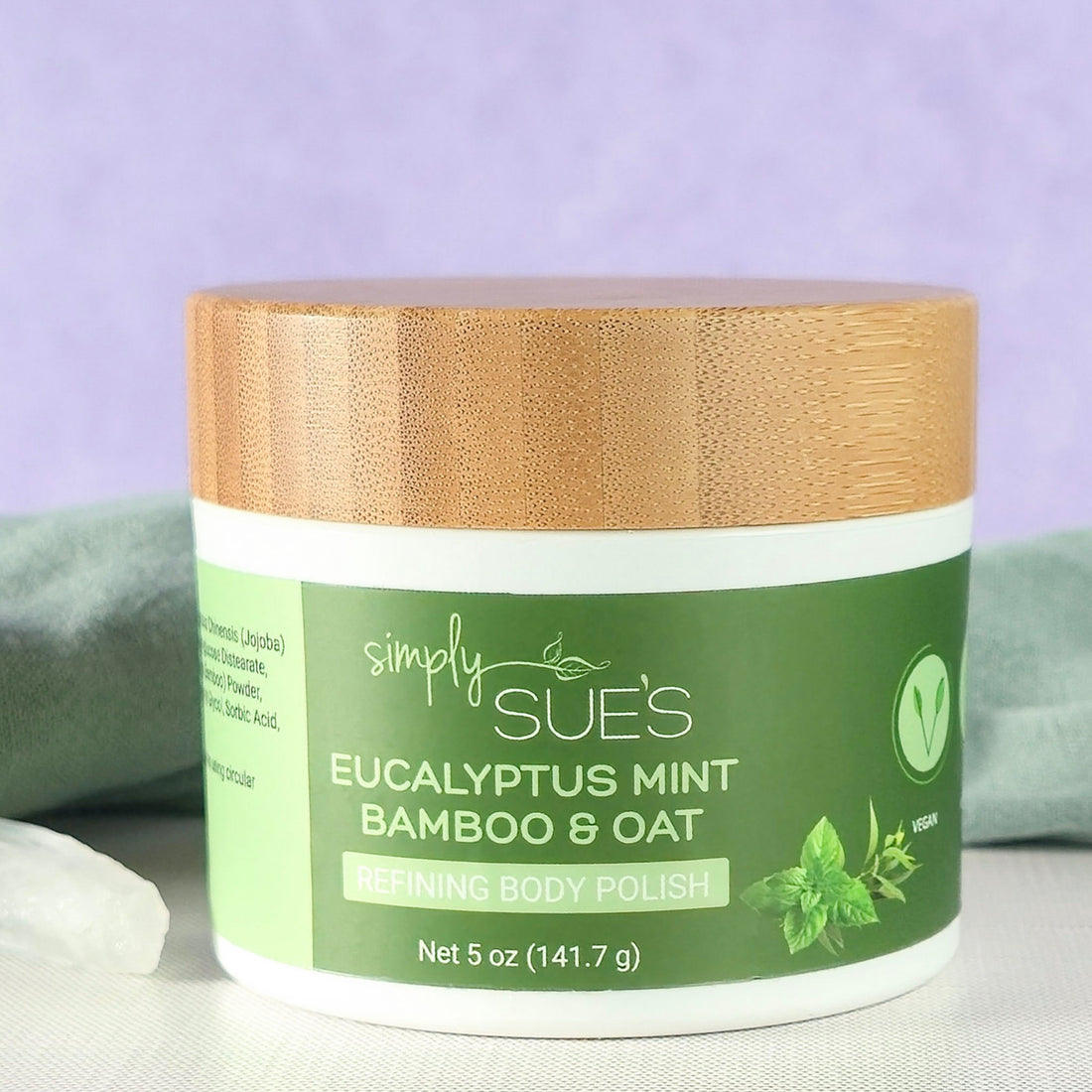 Eucalyptus Mint body polish, exfoliating sugar scrub that smooths dry skin, in a white jar with bamboo lid