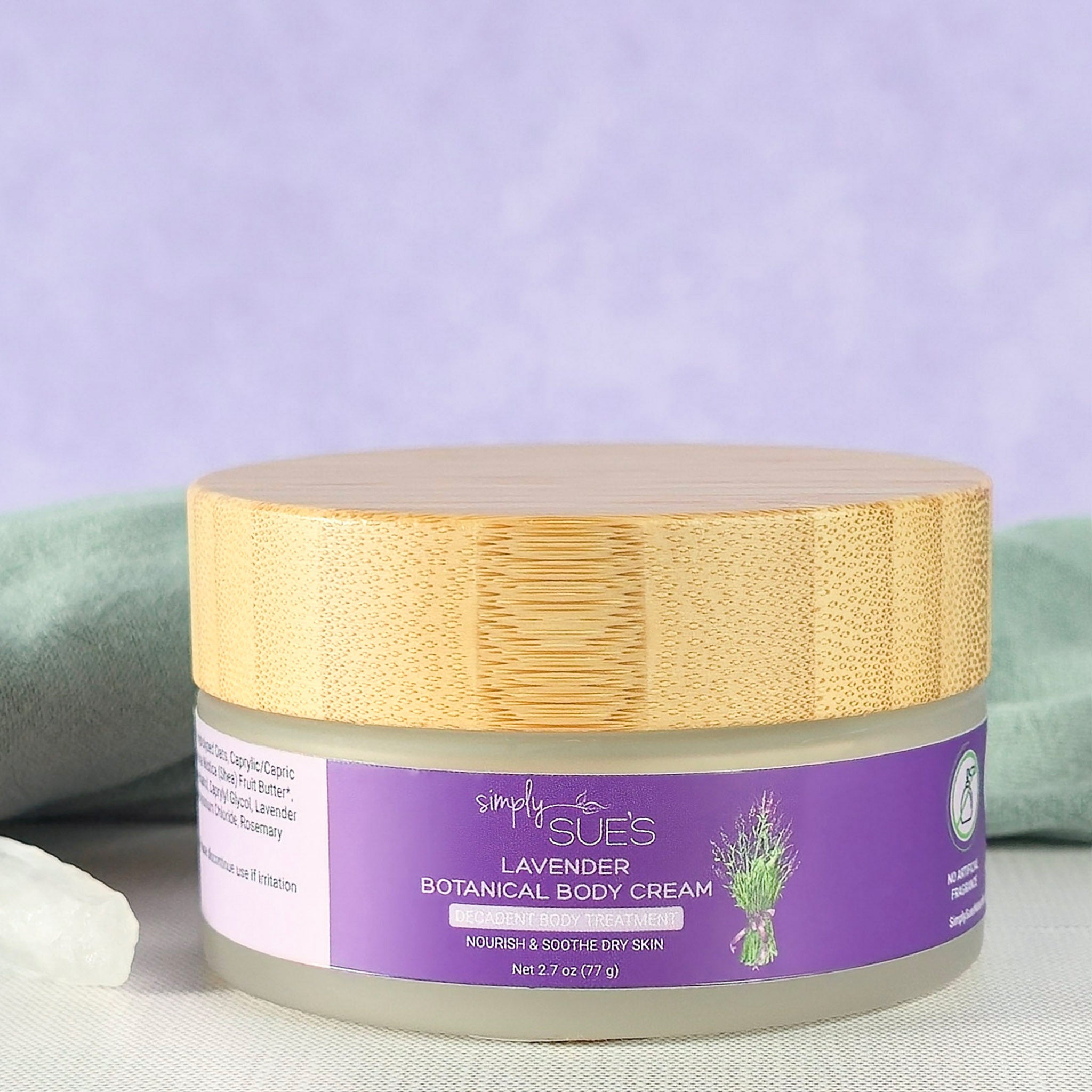 Lavender body cream in glass jar with bamboo cap, natural moisturizing skincare