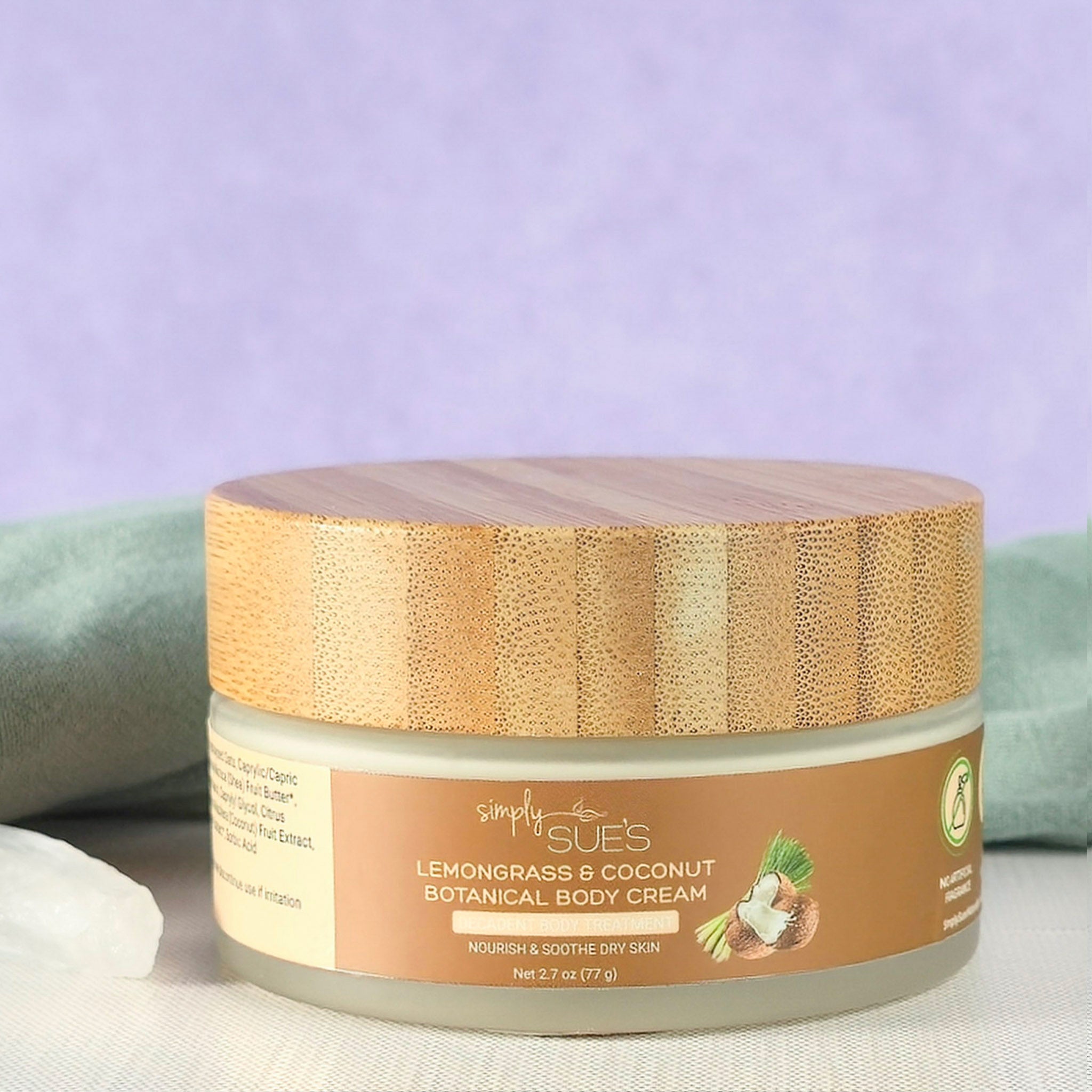 Lemongrass coconut body cream in glass jar with bamboo cap, natural moisturizing skincare