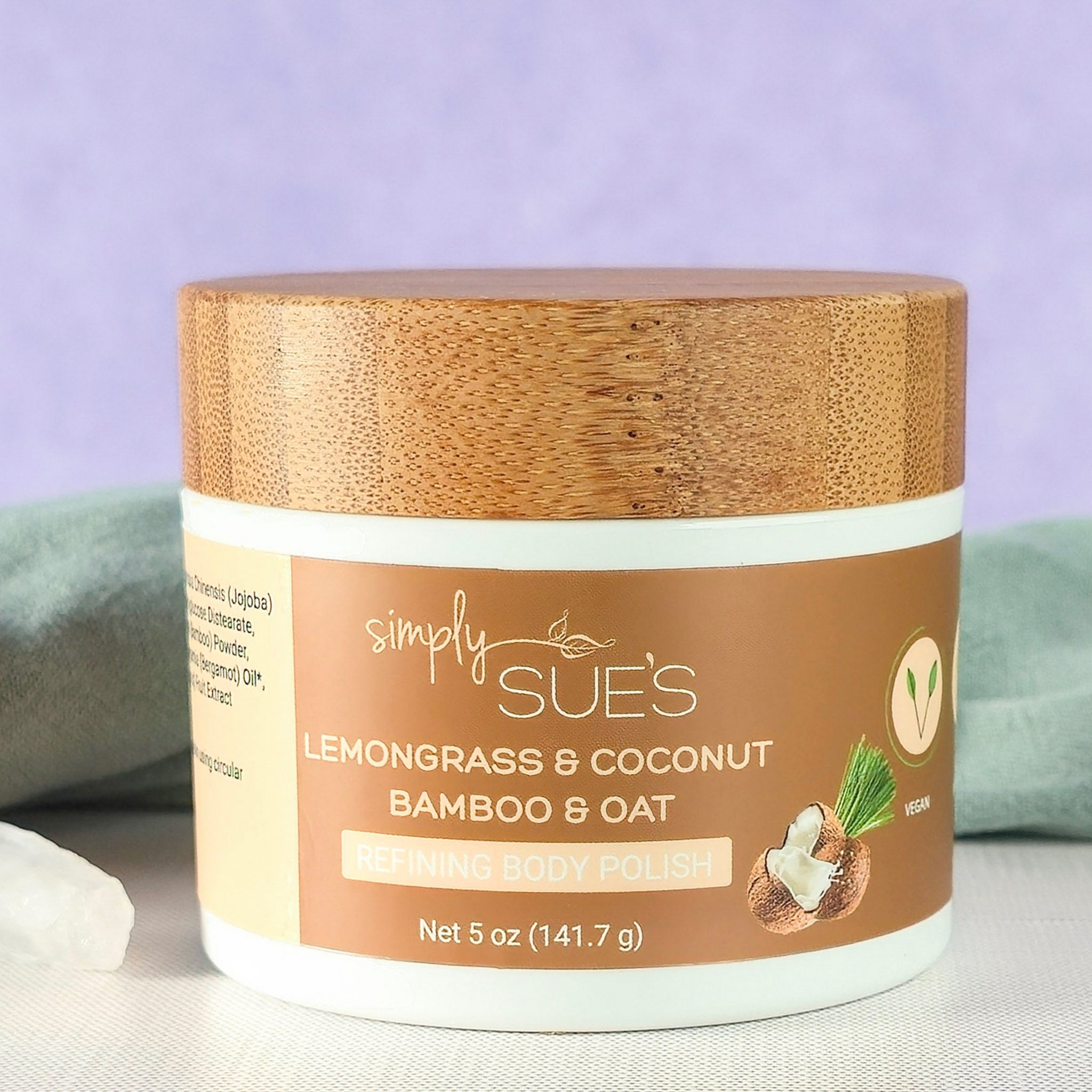 Lemongrass coconut body polish, exfoliating sugar scrub that smooths dry skin, in a white jar with bamboo lid