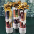 Three lip balm collections with gold bows against a snowy background