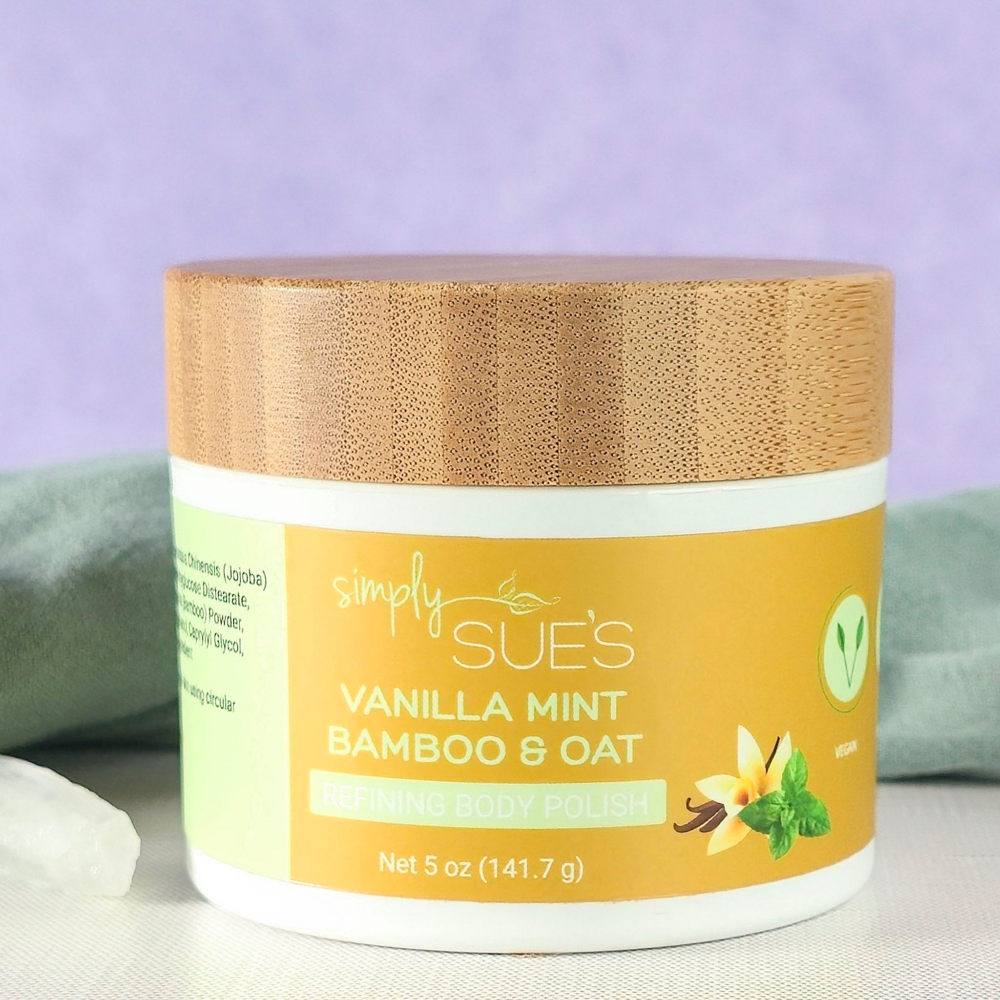 vanilla mint body polish, exfoliating sugar scrub that smooths dry skin, in a white jar with bamboo lid