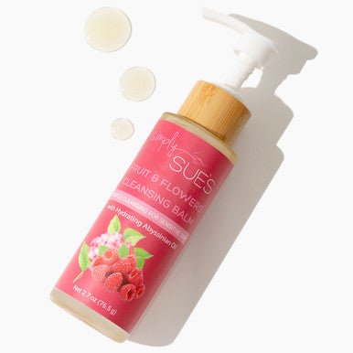 Fruit &amp; Flowers Facial Cleansing Balm on a white background with swatches to show texture of cleansing oil