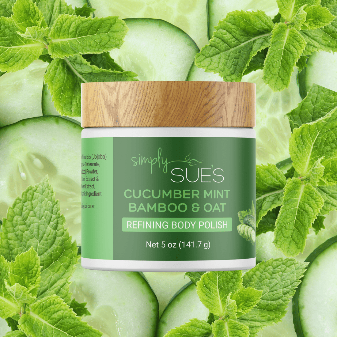 Cucumber Mint Body Polish in a white jar with bamboo cap on a background of fresh slices of cucumber and fresh peppermint