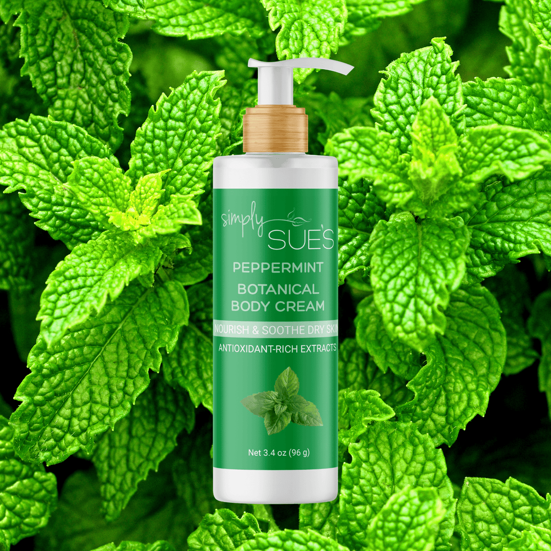Simply Sue’s Peppermint Body Cream with a background of fresh peppermint leaves