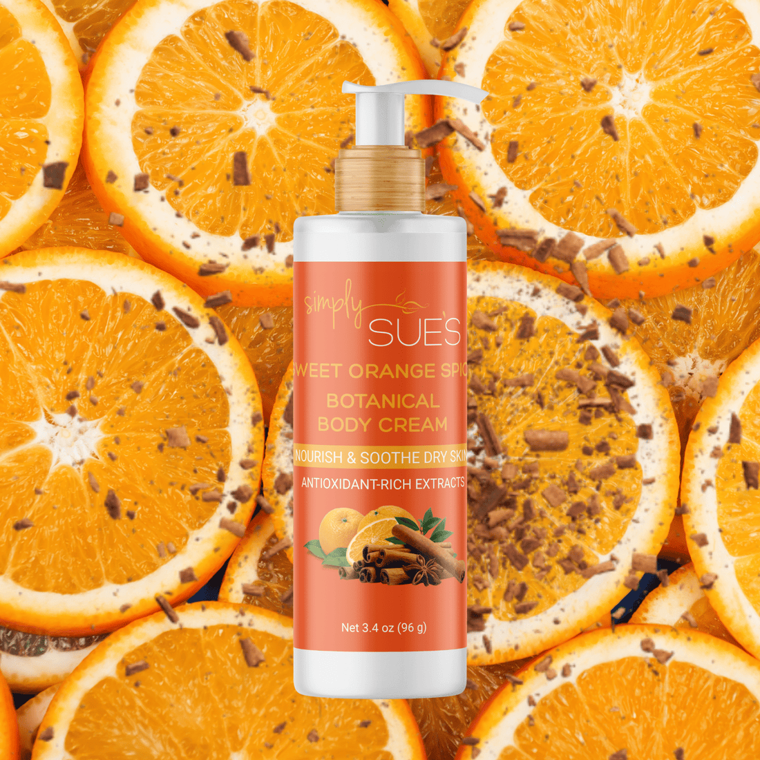 Simply Sue’s Sweet Orange Spice  Body Cream with a background of fresh orange slices dusted with cinnamon